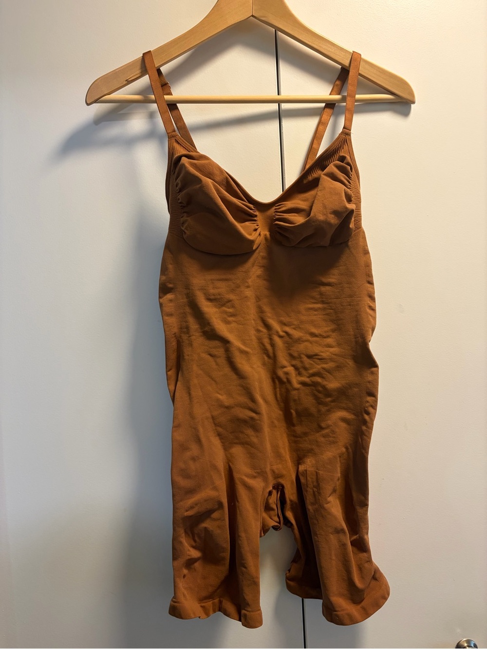 SKIMS Sculpting Bodysuit in Rust Brown